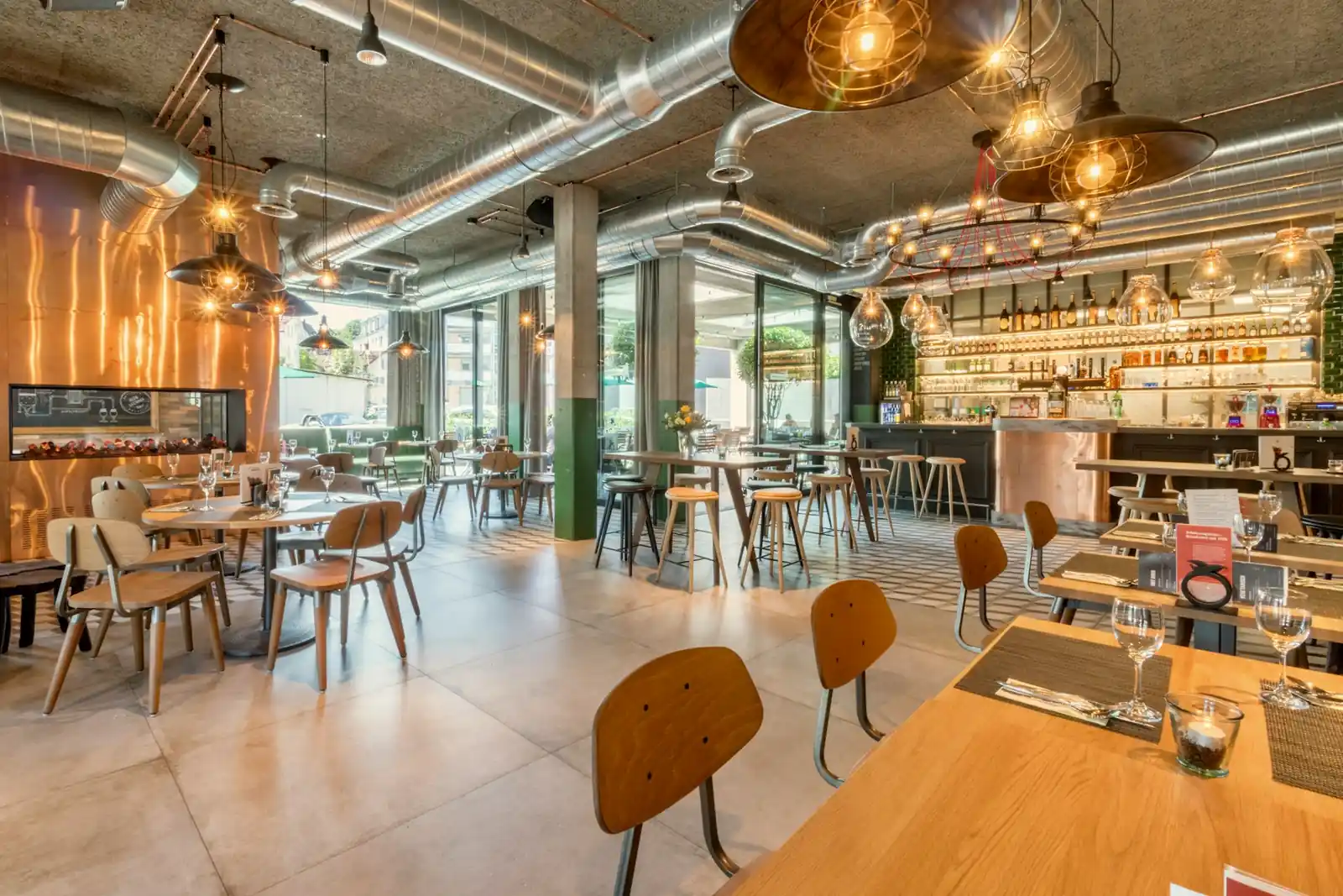 Clean restaurant venue with neatly arranged tables, contemporary seating and a well-maintained dining interior.